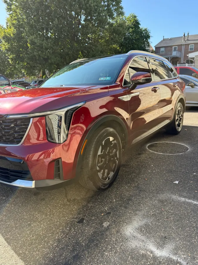 Red Kia SUV with window tint - Shortstop Tint in Philadelphia, PA